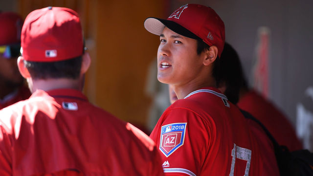 SCOTTSDALE, AZ - FEBRUARY 27: Shohei Ohtani #17 of the Los Angeles Angels of Anaheim talks with teammates in the dugout prior to the start of the first inning against the Colorado Rockies during a Spring Training game at Salt River Fields at Talking Stick on February 27, 2018 in Scottsdale, Arizona.