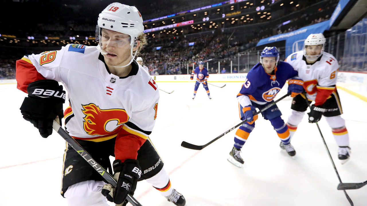 NEW YORK, NY - FEBRUARY 11: Matthew Tkachuk #19 of the Calgary Flames skates towards the puck in the first period against the New York Islanders during their game at Barclays Center on February 11, 2018 in the Brooklyn borough of New York City.