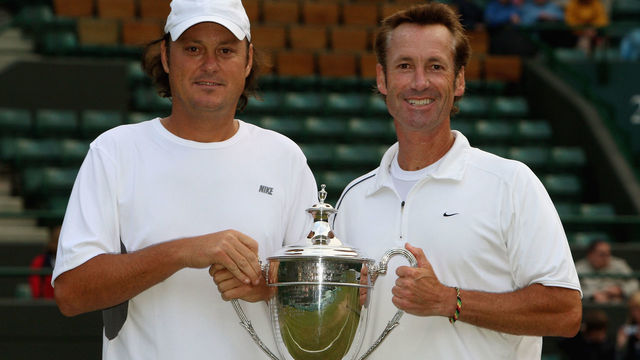 LONDON - JULY 06: Robert Seguso (L) and Ken Flach of United States celebrate with the trophy after winning the men's invitational doubles Final match against Jeremy Bates of Great Britain and Anders Jarryd of Sweden on day thirteen of the Wimbledon Lawn Tennis Championships at the All England Lawn Tennis and Croquet Club on July 6, 2008 in London, England.
