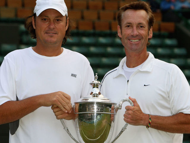 LONDON - JULY 06: Robert Seguso (L) and Ken Flach of United States celebrate with the trophy after winning the men's invitational doubles Final match against Jeremy Bates of Great Britain and Anders Jarryd of Sweden on day thirteen of the Wimbledon Lawn Tennis Championships at the All England Lawn Tennis and Croquet Club on July 6, 2008 in London, England.