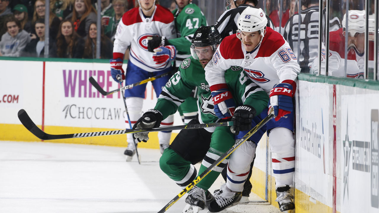 DALLAS, TX - NOVEMBER 21: Andrew Shaw #65 of the Montreal Canadiens tries to keep the puck away against Greg Pateryn #29 of the Dallas Stars at the American Airlines Center on November 21, 2017 in Dallas, Texas.