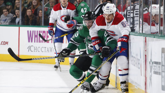 DALLAS, TX - NOVEMBER 21: Andrew Shaw #65 of the Montreal Canadiens tries to keep the puck away against Greg Pateryn #29 of the Dallas Stars at the American Airlines Center on November 21, 2017 in Dallas, Texas.