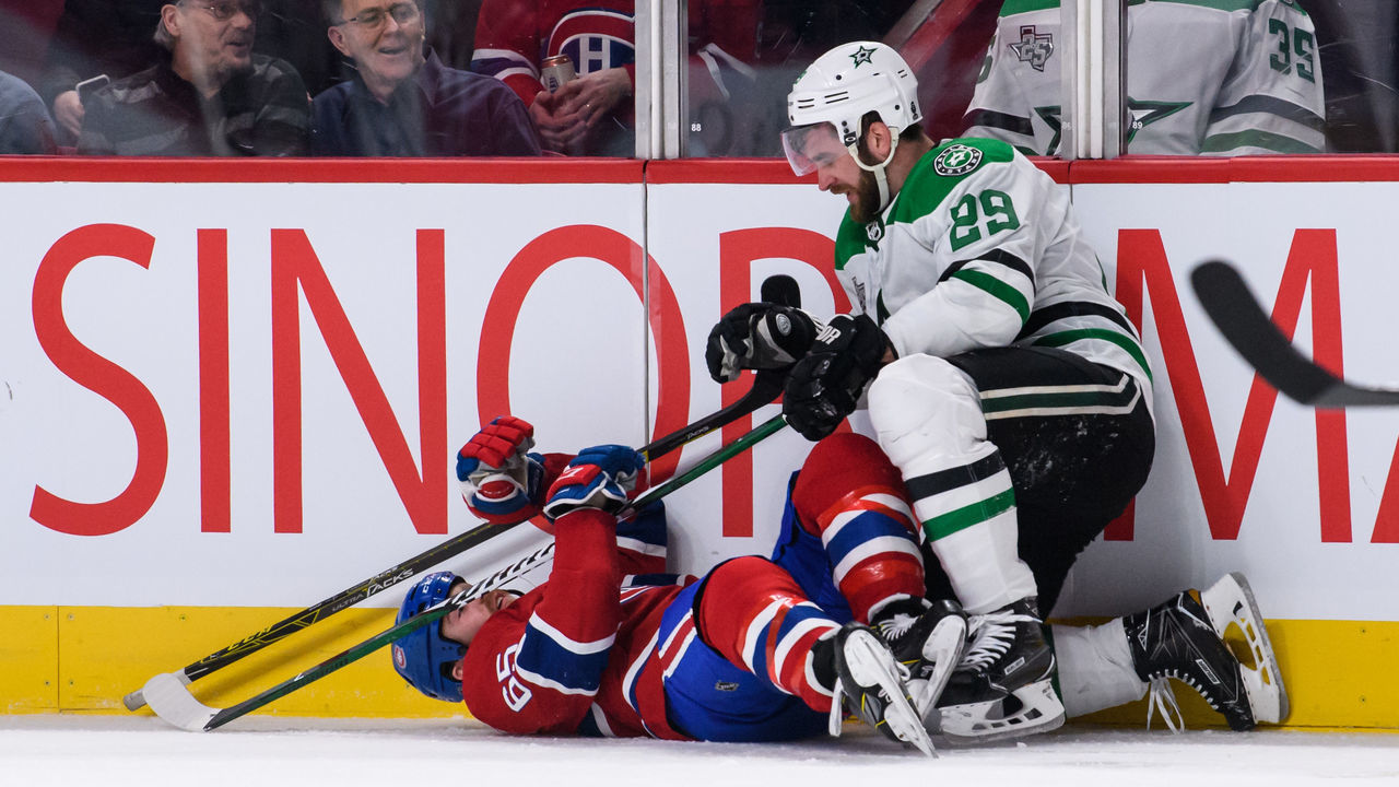 MONTREAL, QC - MARCH 13: Dallas Stars defenseman Greg Pateryn (29) checks Montreal Canadiens right wing Andrew Shaw (65) during the third period of the NHL game between the Dallas Stars and the Montreal Canadiens on March 13, 2018, at the Bell Centre in Montreal, QC