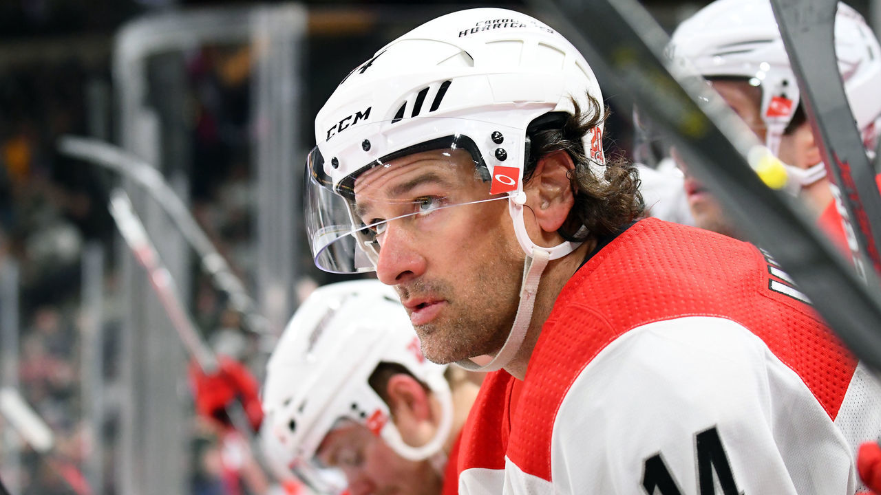 ST. PAUL, MN - MARCH 06: Carolina Hurricanes Right Wing Justin Williams (14) looks on from the bench during a NHL game between the Minnesota Wild and Carolina Hurricanes on March 6, 2018 at Xcel Energy Center in St. Paul, MN. The Wild defeated the Hurricanes 6-2.