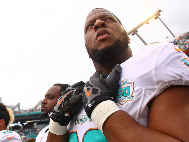 MIAMI GARDENS, FL - SEPTEMBER 27: Ndamukong Suh #93 of the Miami Dolphins looks on before the game against the Buffalo Bills at Sun Life Stadium on September 27, 2015 in Miami Gardens, Florida.