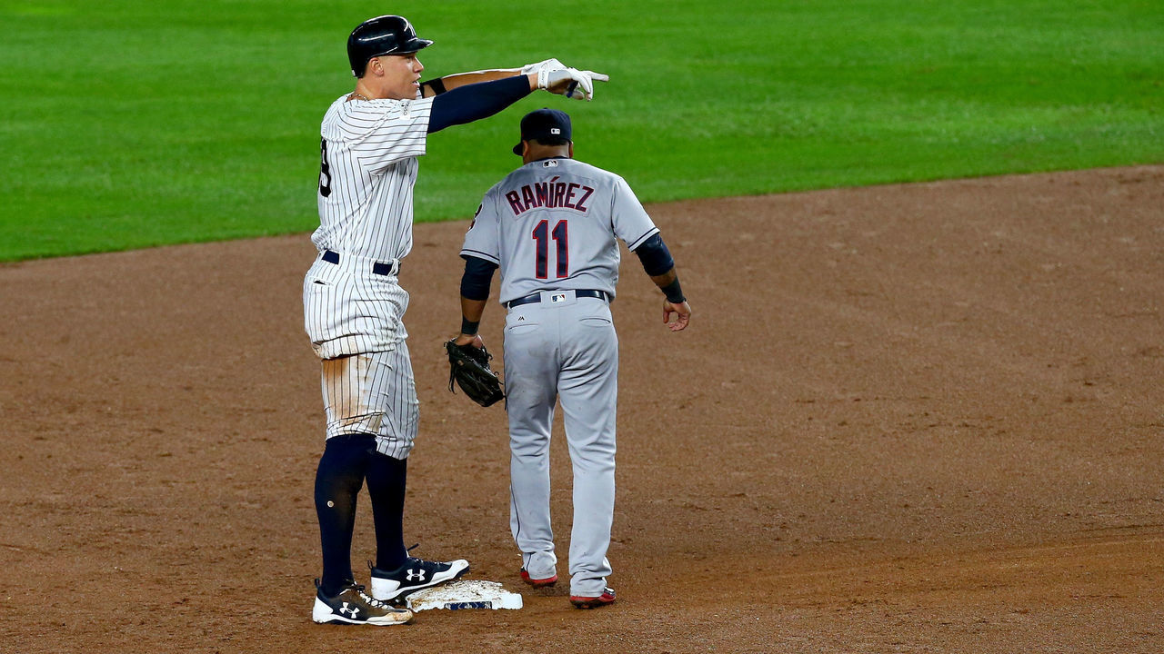NEW YORK, NY - OCTOBER 09: Aaron Judge #99 of the New York Yankees celebrates from second base after hitting a double to left field to score Brett Gardner #11 and Aaron Hicks #31 against Trevor Bauer #47 of the Cleveland Indians during the second inning in Game Four of the American League Divisional Series at Yankee Stadium on October 9, 2017 in the Bronx borough of New York City.
