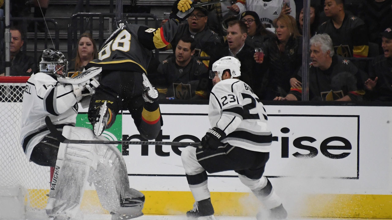 LAS VEGAS, NV - FEBRUARY 27: Nate Schmidt #88 of the Vegas Golden Knights crashes into Jack Campbell #1 of the Los Angeles Kings as Dustin Brown #23 of the Kings looks on in the first period of their game at T-Mobile Arena on February 27, 2018 in Las Vegas, Nevada. Schmidt recieved a two-minute minor penalty for interference on the play.