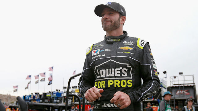 AVONDALE, AZ - MARCH 10: Jimmie Johnson, driver of the #48 Lowe's for Pros Chevrolet, stands in the garage area during practice for the Monster Energy NASCAR Cup Series TicketGuardian 500 at ISM Raceway on March 10, 2018 in Avondale, Arizona.