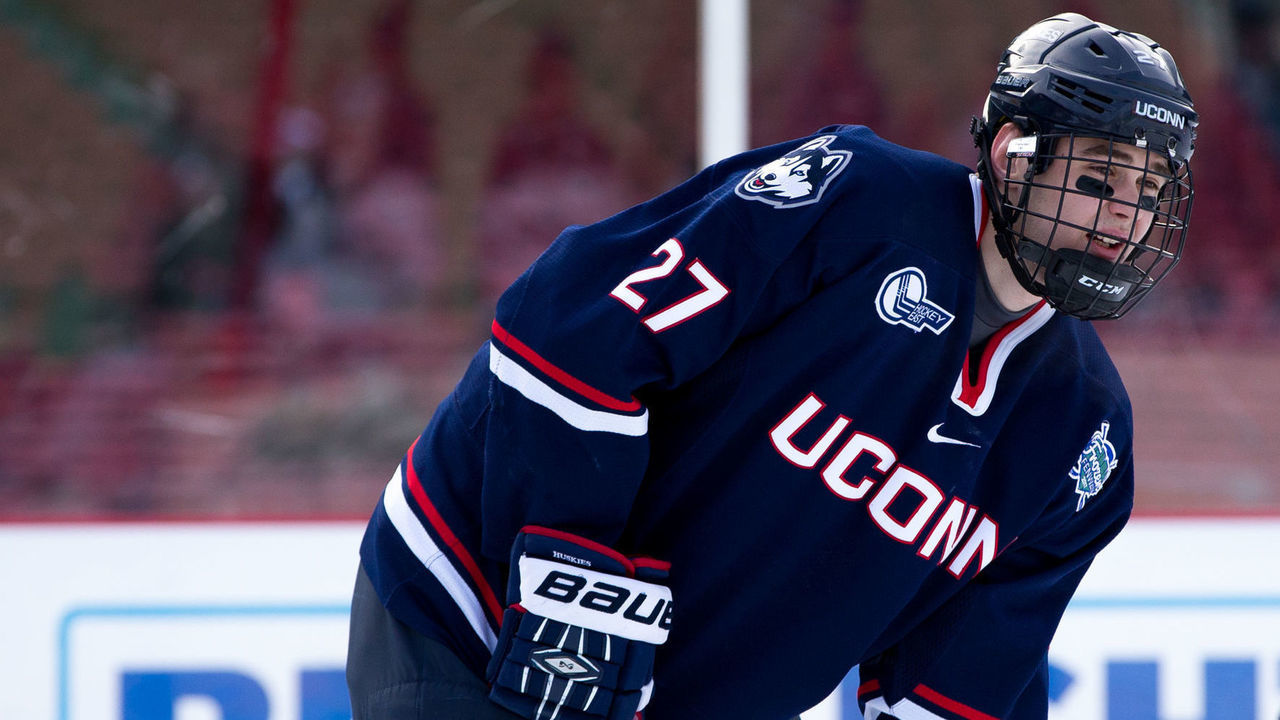BOSTON, MA - JANUARY 14: Maxim Letunov #27 of the Connecticut Huskies skates against the Maine Black Bears during an NCAA hockey game at Fenway Park during 'Frozen Fenway' on January 14, 2017 in Boston, Massachusetts. The Black Bears won 4-0.