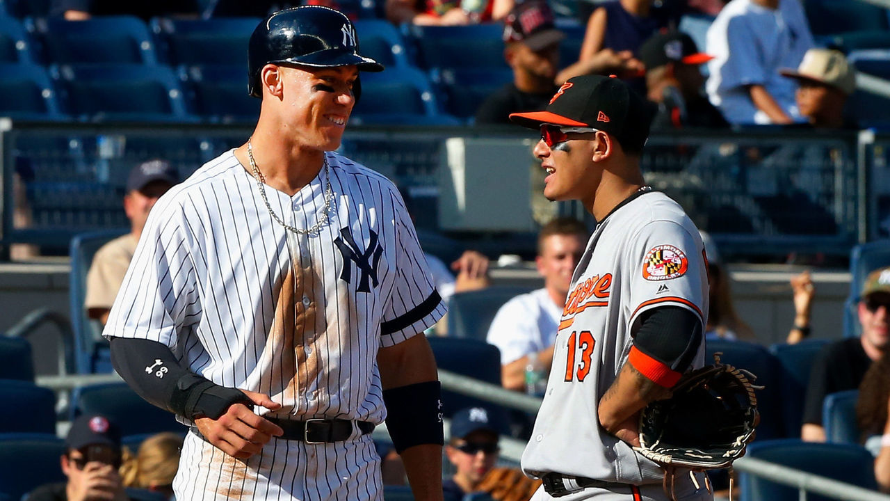 NEW YORK, NY - SEPTEMBER 17: Aaron Judge #99 of the New York Yankees and Manny Machado #13 of the Baltimore Orioles talk at third base during a game at Yankee Stadium on September 17, 2017 in the Bronx borough of New York City. The Orioles defeated the Yankees 6-4.