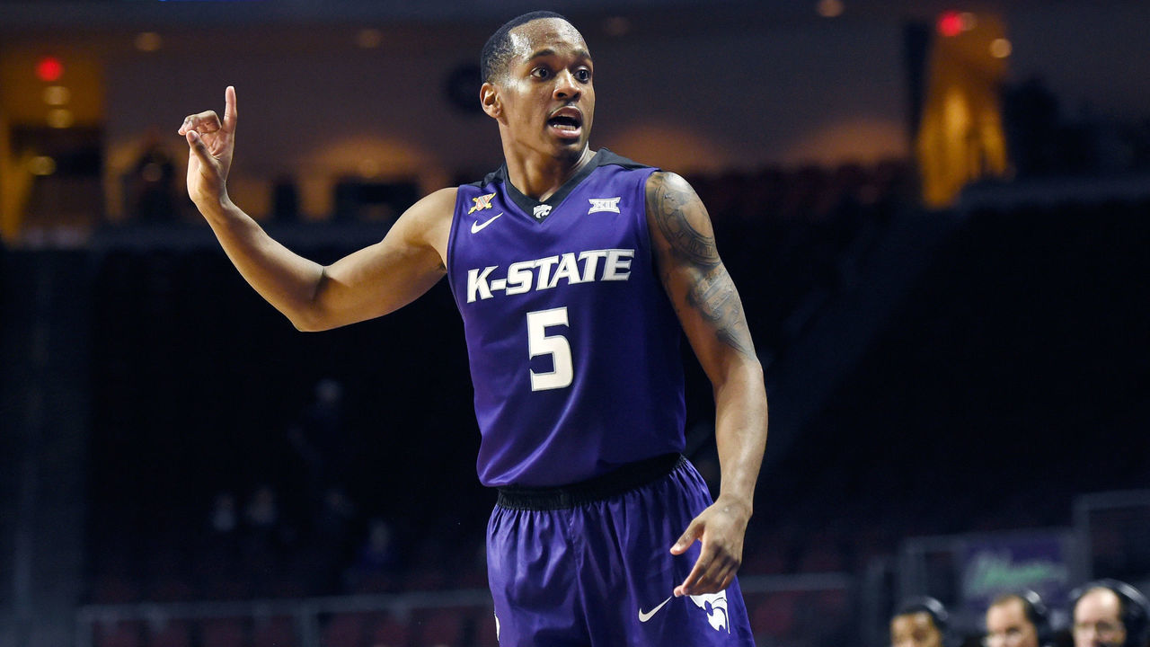 LAS VEGAS, NV - NOVEMBER 24: Barry Brown Jr. #5 of the Kansas State Wildcats signals against the George Washington Colonials during the 2017 Continental Tire Las Vegas Invitational basketball tournament at the Orleans Arena on November 24, 2017 in Las Vegas, Nevada. Kansas State won 67-59.