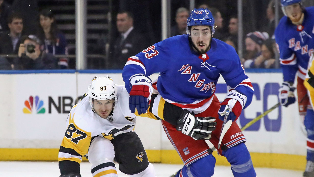 NEW YORK, NY - MARCH 14: Sidney Crosby #87 of the Pittsburgh Penguins holds back Mika Zibanejad #93 of the New York Rangers during the second period at Madison Square Garden on March 14, 2018 in New York City.
