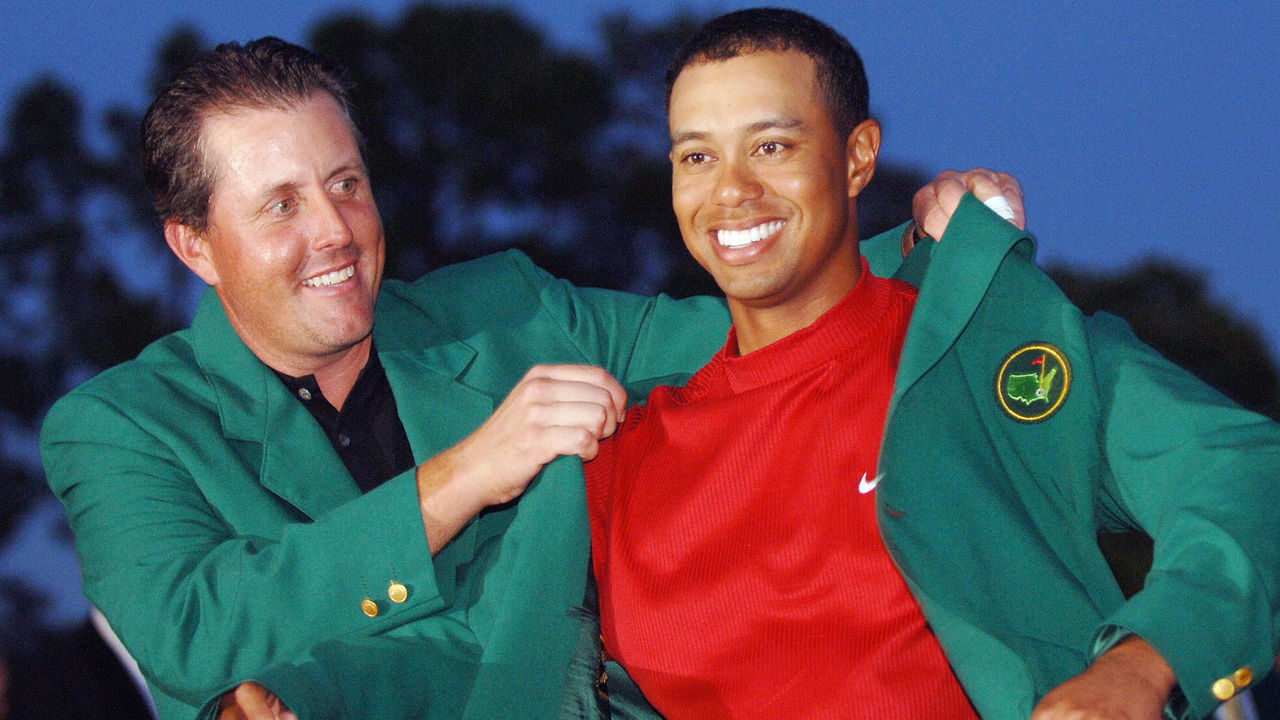 AUGUSTA, UNITED STATES: US golfer Tiger Woods (R) is awarded his green jacket by 2004 champion Phil Mickelson of the US at the 2005 Masters Golf Tournament Championship 10 April 2005 at the Augusta National Golf Club in Augusta, Ga. Woods claimed his 4th Masters title by defeating fellow American Chris DiMarco in a one-hole playoff. AFP PHOTO/Roberto SCHMIDT