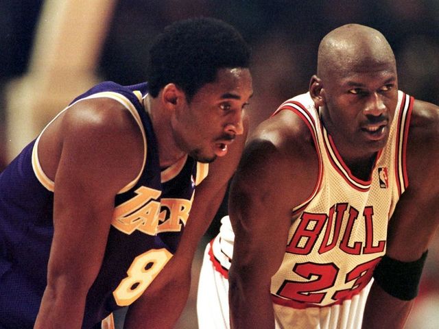CHICAGO, UNITED STATES: Los Angeles Lakers guard Kobe Bryant(L) and Chicago Bulls guard Michael Jordan(R) talk during a free-throw attempt during the fourth quarter 17 December at the United Center in Chicago. Bryant, who is 19 and bypassed college basketball to play in the NBA, scored a team-high 33 points off the bench, and Jordan scored a team-high 36 points. The Bulls defeated the Lakers 104-83. AFP PHOTO VINCENT LAFORET