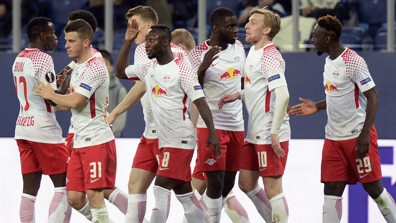 Leipzig's players celebrate a goal scored by Jean-Kevin Augustin during the UEFA Europa League Round of 16 second leg football match between FC Zenit and RB Leipzig on March 15, 2018 in Saint Petersburg. / AFP PHOTO / Olga MALTSEVA
