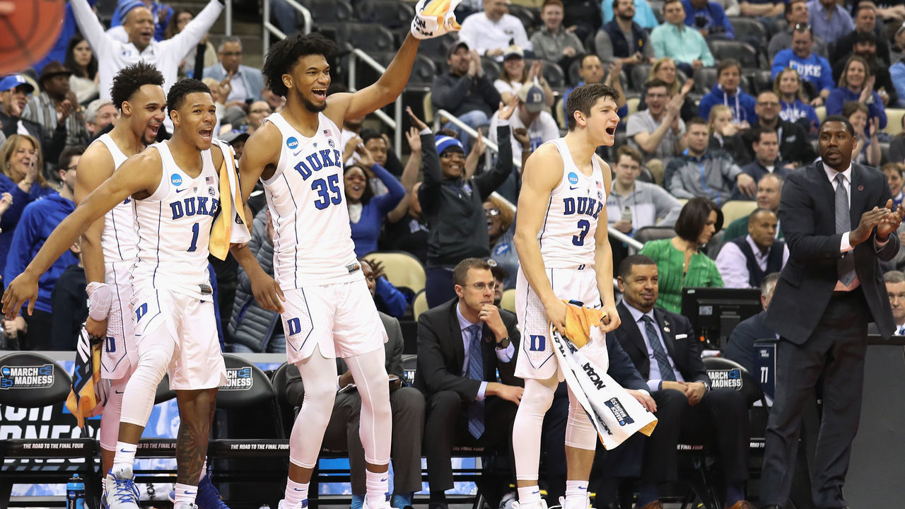 PITTSBURGH, PA - MARCH 15: (L-R) Trevon Duval #1, Marvin Bagley III #35 and Grayson Allen #3 of the Duke Blue Devils celebrate en route to defeating the Iona Gaels 89-67 in the game during the first half of the game in the first round of the 2018 NCAA Men's Basketball Tournament at PPG PAINTS Arena on March 15, 2018 in Pittsburgh, Pennsylvania.
