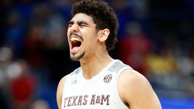 ST LOUIS, MO - MARCH 08: Tyler Davis #34 of the Texa A&M Aggies celebrates against the Alabama Crimson Tide during the second round of the 2018 SEC Basketball Tournament at Scottrade Center on March 8, 2018 in St Louis, Missouri.