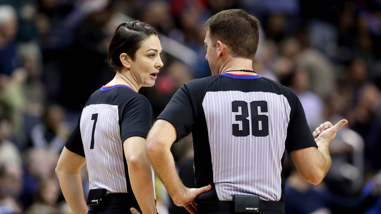 WASHINGTON, DC - JANUARY 10: Referees Lauren Holtkamp #7 and David Jones #36 talk during a timeout in the Washington Wizards and Utah Jazz game at Capital One Arena on January 10, 2018 in Washington, DC.