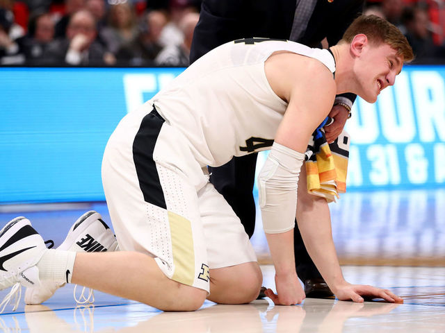 DETROIT, MI - MARCH 16: Isaac Haas #44 of the Purdue Boilermakers reacts after falling to the court on a foul by Cal State Fullerton Titans during the second half of the game in the first round of the 2018 NCAA Men's Basketball Tournament at Little Caesars Arena on March 16, 2018 in Detroit, Michigan.