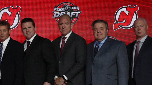 CHICAGO, IL - JUNE 23: (L-R) General manager Ray Shero, draft team member, draft runner Thomas Harris, owner Josh Harris, first overall pick Nico Hischier, director of amateur scouting Paul Castron, director of player personnel Dan MacKinnon, assistant general manager Tom Fitzgerald, assistant director of amateur scouting Gates Orlando and head coach John Hynes of the New Jersey Devils pose for a photo onstage during Round One of the 2017 NHL Draft at United Center on June 23, 2017 in Chicago, Illinois.