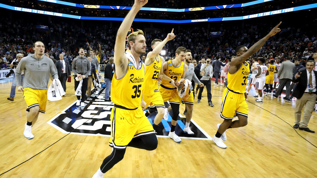 CHARLOTTE, NC - MARCH 16: The UMBC Retrievers celebrate their 74-54 victory over the Virginia Cavaliers during the first round of the 2018 NCAA Men's Basketball Tournament at Spectrum Center on March 16, 2018 in Charlotte, North Carolina.