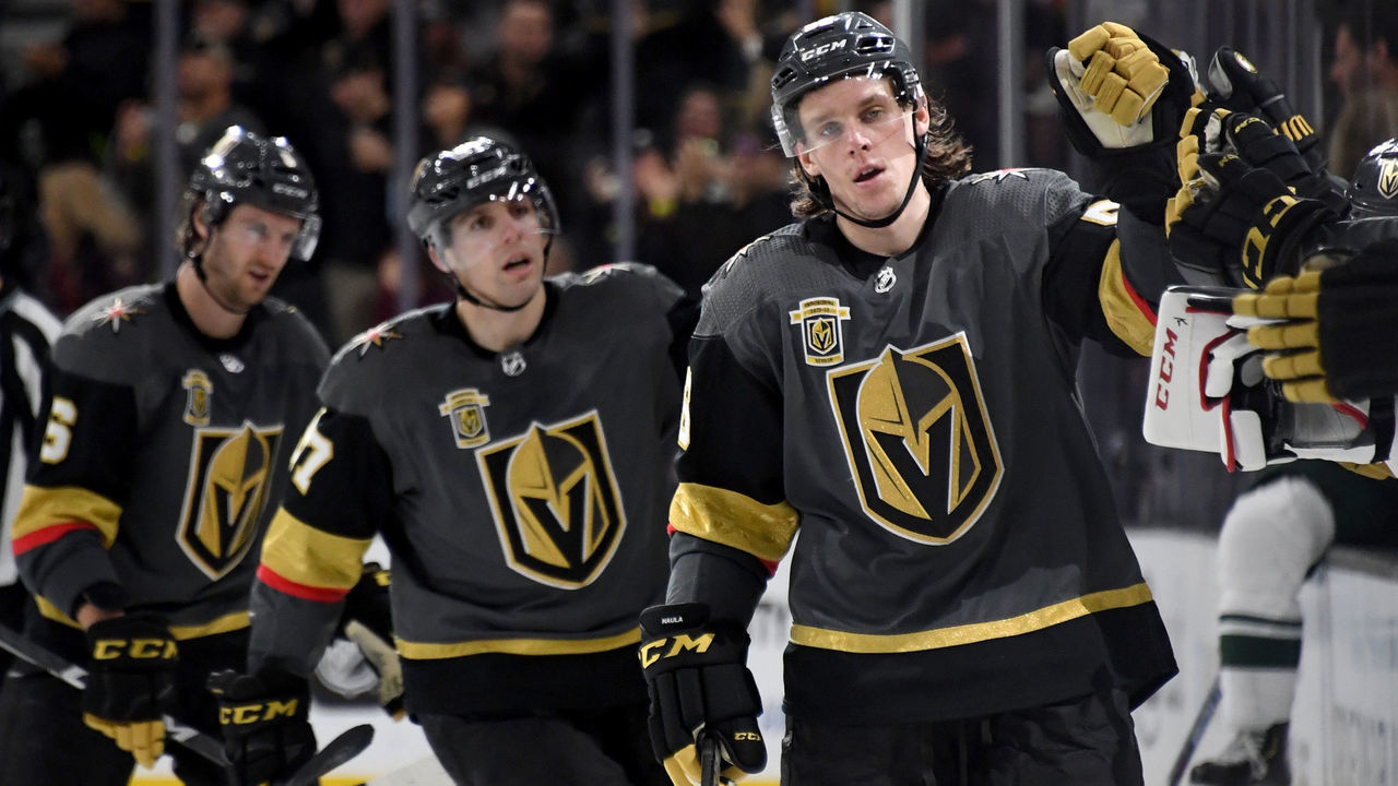 LAS VEGAS, NV - MARCH 16: (L-R) Colin Miller #6, David Perron #57 and Erik Haula #56 of the Vegas Golden Knights celebrate with teammates on the bench after Miller and Perron assisted Haula on a third-period goal against the Minnesota Wild during their game at T-Mobile Arena on March 16, 2018 in Las Vegas, Nevada. The Wild won 4-2.