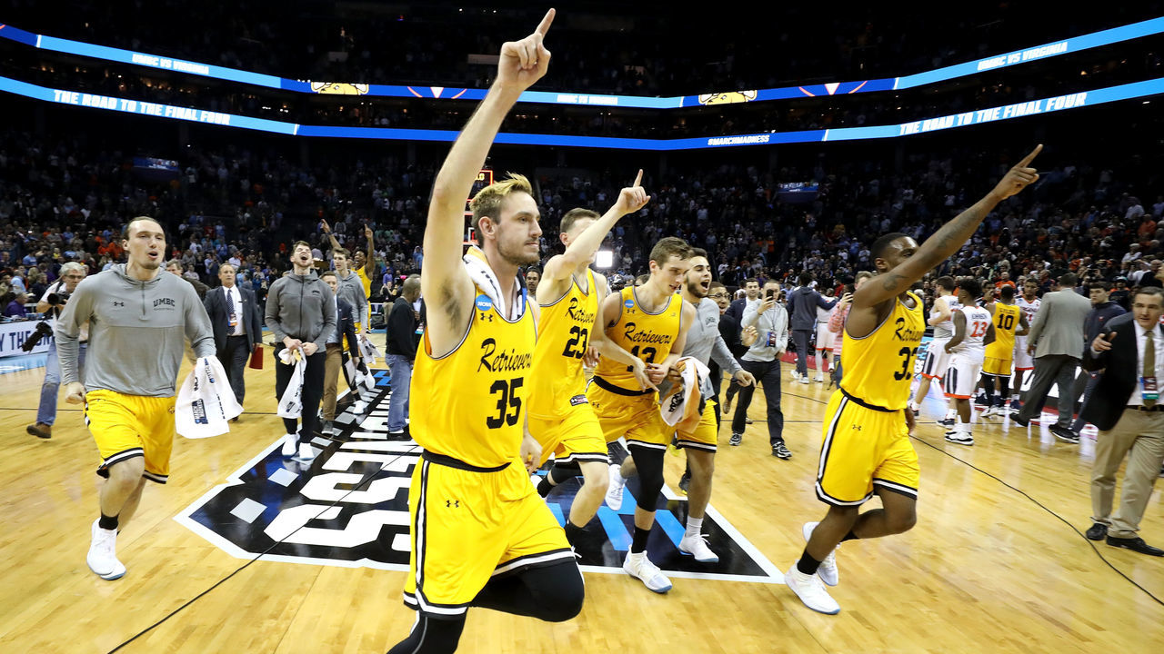 CHARLOTTE, NC - MARCH 16: The UMBC Retrievers celebrate their 74-54 victory over the Virginia Cavaliers during the first round of the 2018 NCAA Men's Basketball Tournament at Spectrum Center on March 16, 2018 in Charlotte, North Carolina.