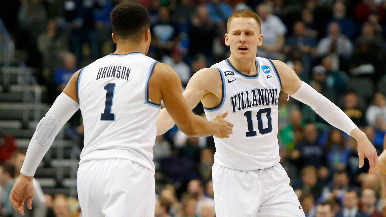 PITTSBURGH, PA - MARCH 17: Donte DiVincenzo #10 of the Villanova Wildcats celebrates with his teammate Jalen Brunson #1 against the Alabama Crimson Tide during the second half in the second round of the 2018 NCAA Men's Basketball Tournament at PPG PAINTS Arena on March 17, 2018 in Pittsburgh, Pennsylvania.