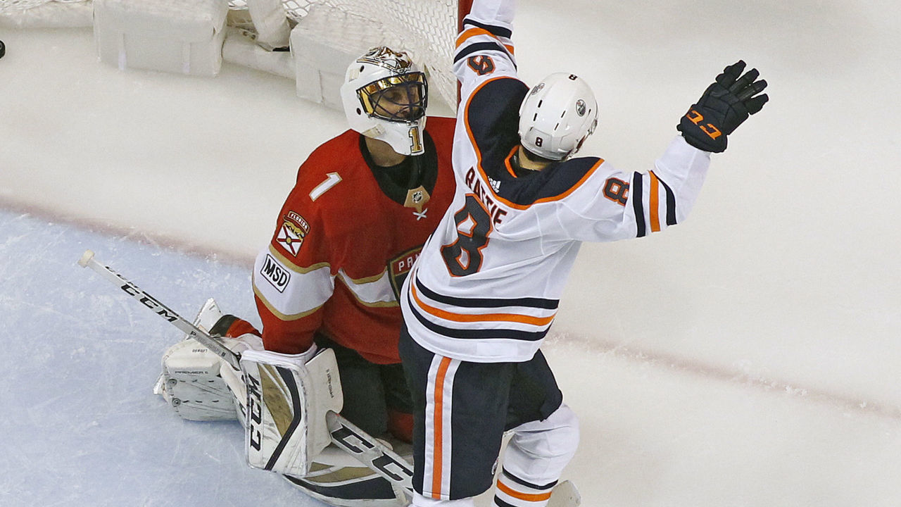SUNRISE, FL - MARCH 17: Goaltender Roberto Luongo #1 of the Florida Panthers looks up as Adam Larsson #6 celebrates his game winning goal with Ty Rattie #8 of the Edmonton Oilers at the BB&T Center on March 17, 2018 in Sunrise, Florida. The Oilers defeated the Panthers 4-2.