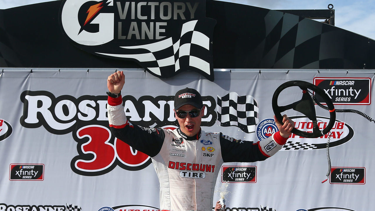 FONTANA, CA - MARCH 17: Joey Logano, driver of the #22 Discount Tire Ford, celebrates in victory lane after winning the NASCAR Xfinity Series Roseanne 300 at Auto Club Speedway on March 17, 2018 in Fontana, California.
