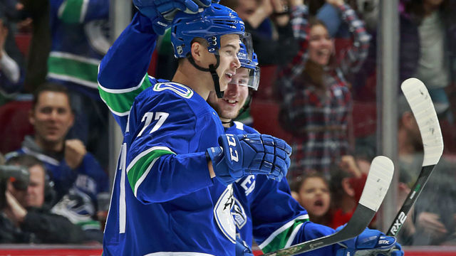 VANCOUVER, BC - MARCH 17: Nikolay Goldobin #77 of the Vancouver Canucks is congratulated after scoring during their NHL game against the San Jose Sharks at Rogers Arena March 17, 2018 in Vancouver, British Columbia, Canada.
