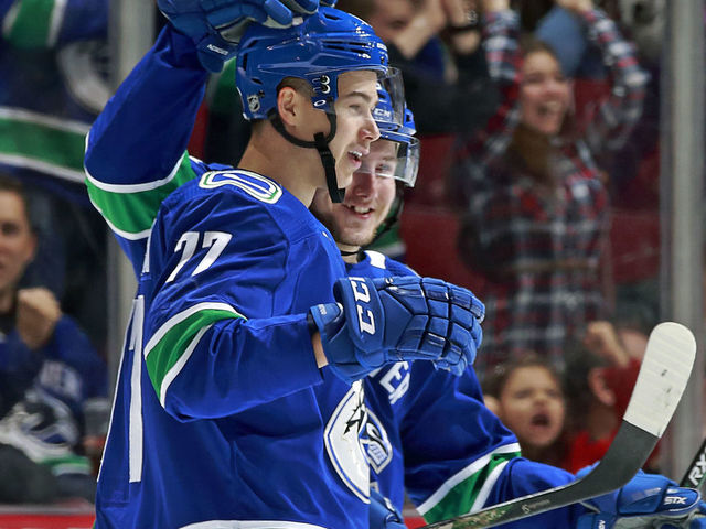 VANCOUVER, BC - MARCH 17: Nikolay Goldobin #77 of the Vancouver Canucks is congratulated after scoring during their NHL game against the San Jose Sharks at Rogers Arena March 17, 2018 in Vancouver, British Columbia, Canada.