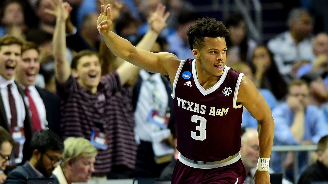 CHARLOTTE, NC - MARCH 18: Admon Gilder #3 of the Texas A&M Aggies reacts after a three point shot against the North Carolina Tar Heels during the second round of the 2018 NCAA Men's Basketball Tournament at Spectrum Center on March 18, 2018 in Charlotte, North Carolina.