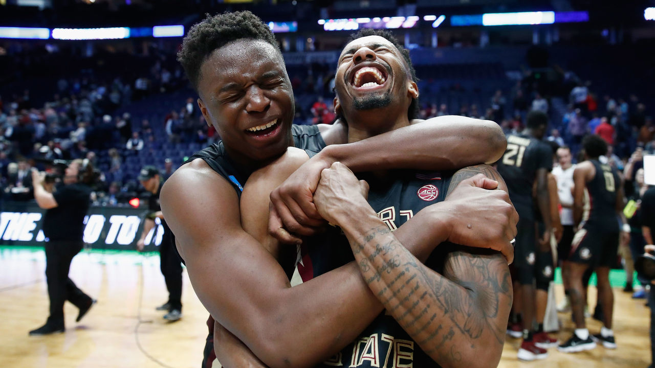 NASHVILLE, TN - MARCH 18: Mfiondu Kabengele #25 of the Florida State Seminoles celebrates with Braian Angola #11 after defeating the Xavier Musketeers in the second round of the 2018 Men's NCAA Basketball Tournament at Bridgestone Arena on March 18, 2018 in Nashville, Tennessee.