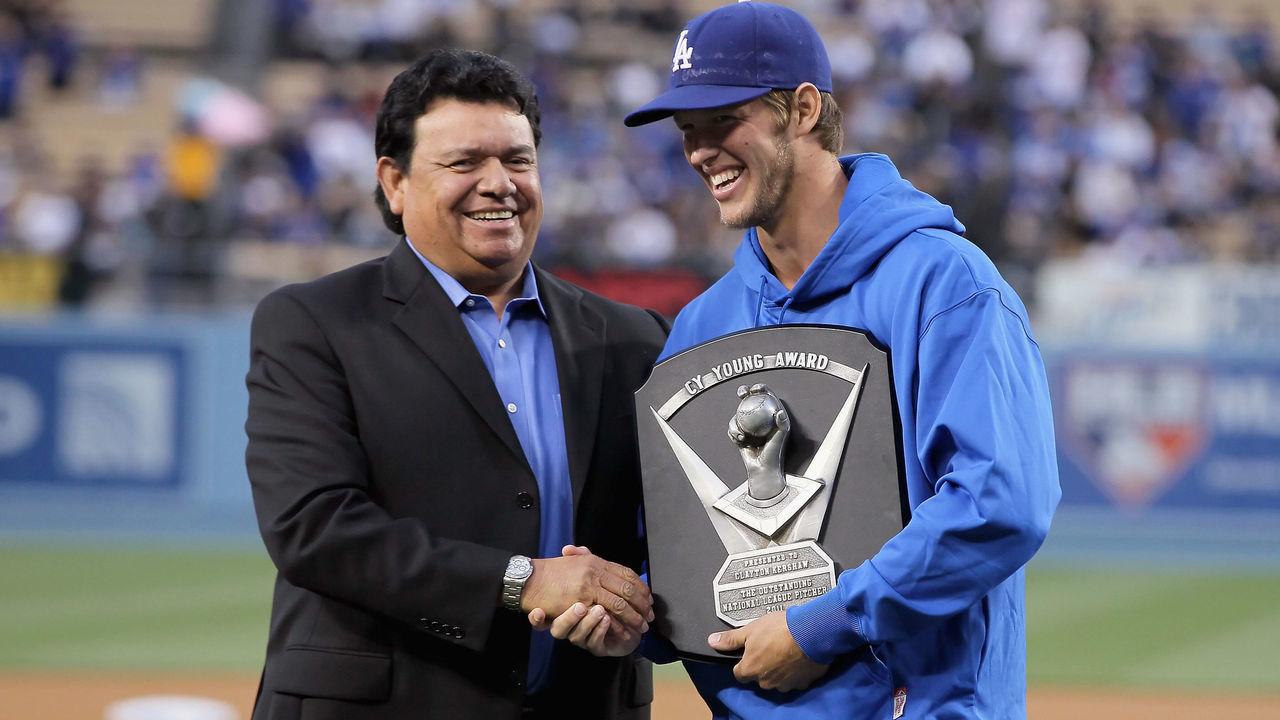 LOS ANGELES, CA - APRIL 11: Pitcher Clayton Kershaw (R) #22 of the Los Angeles Dodgers is presented the National League Cy Young Award plaque by former Dodger pitcher Fernando Valenzuela prior to the start of the game against the Pittsburgh Pirates at Dodger Stadium on April 11, 2012 in Los Angeles, California.