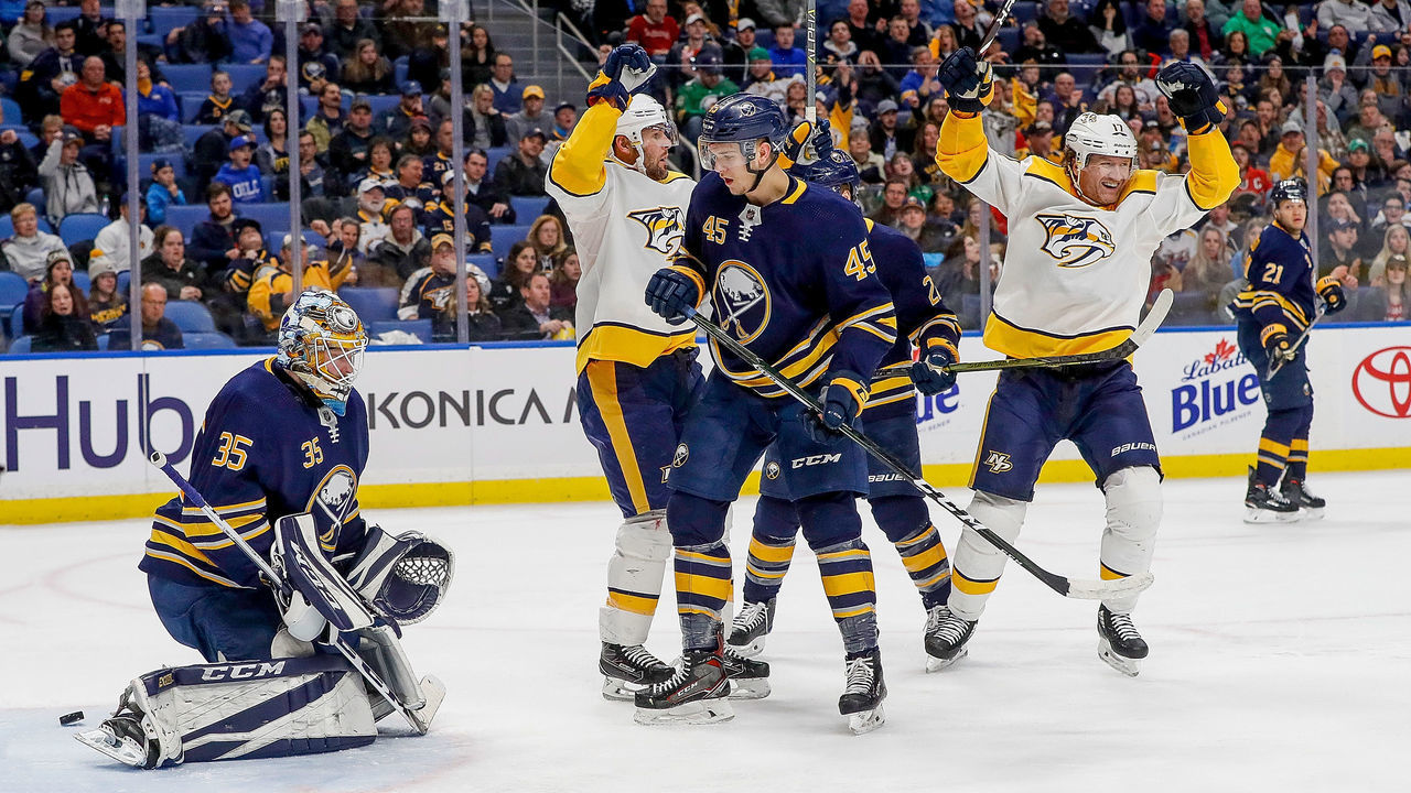 NASHVILLE, TN - MARCH 19: Mike Fisher #12 celebrates his goal with Scott Hartnell #17 of the Nashville Predators against Linus Ullmark #35 and Brendan Guhle #45 of the Buffalo Sabres during an NHL game at KeyBank Center on March 19, 2018 in Buffalo, New York.