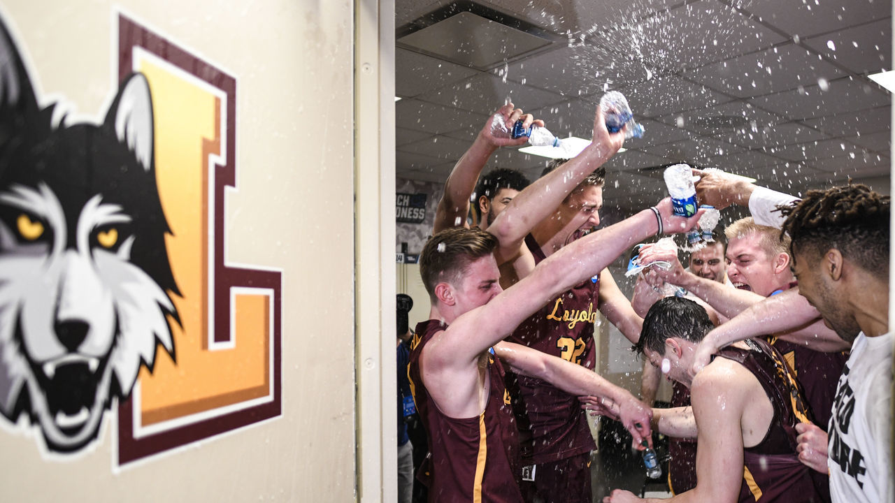 DALLAS, TX - MARCH 17: Clayton Custer (13) of the Loyola (Il) Ramblers gets a water bath in the locker room after the game in the second round of the 2018 NCAA Men's Basketball Tournament held at the American Airlines Center on March 17, 2018 in Dallas, Texas. Loyola-Chicago defeats Tennessee 63-62.