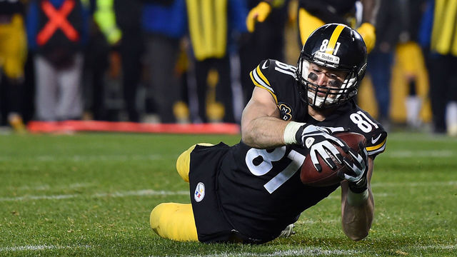 PITTSBURGH, PA - DECEMBER 17: Jesse James #81 of the Pittsburgh Steelers dives for the end zone for an apparent touchdown in the fourth quarter during the game against the New England Patriots at Heinz Field on December 17, 2017 in Pittsburgh, Pennsylvania. After official review, it was ruled an incomplete pass