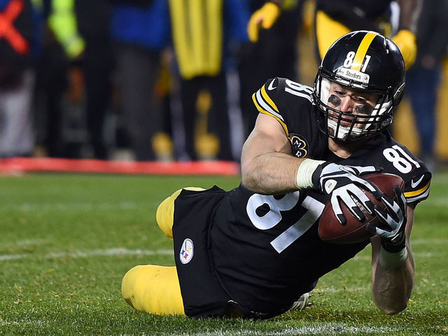 PITTSBURGH, PA - DECEMBER 17: Jesse James #81 of the Pittsburgh Steelers dives for the end zone for an apparent touchdown in the fourth quarter during the game against the New England Patriots at Heinz Field on December 17, 2017 in Pittsburgh, Pennsylvania. After official review, it was ruled an incomplete pass