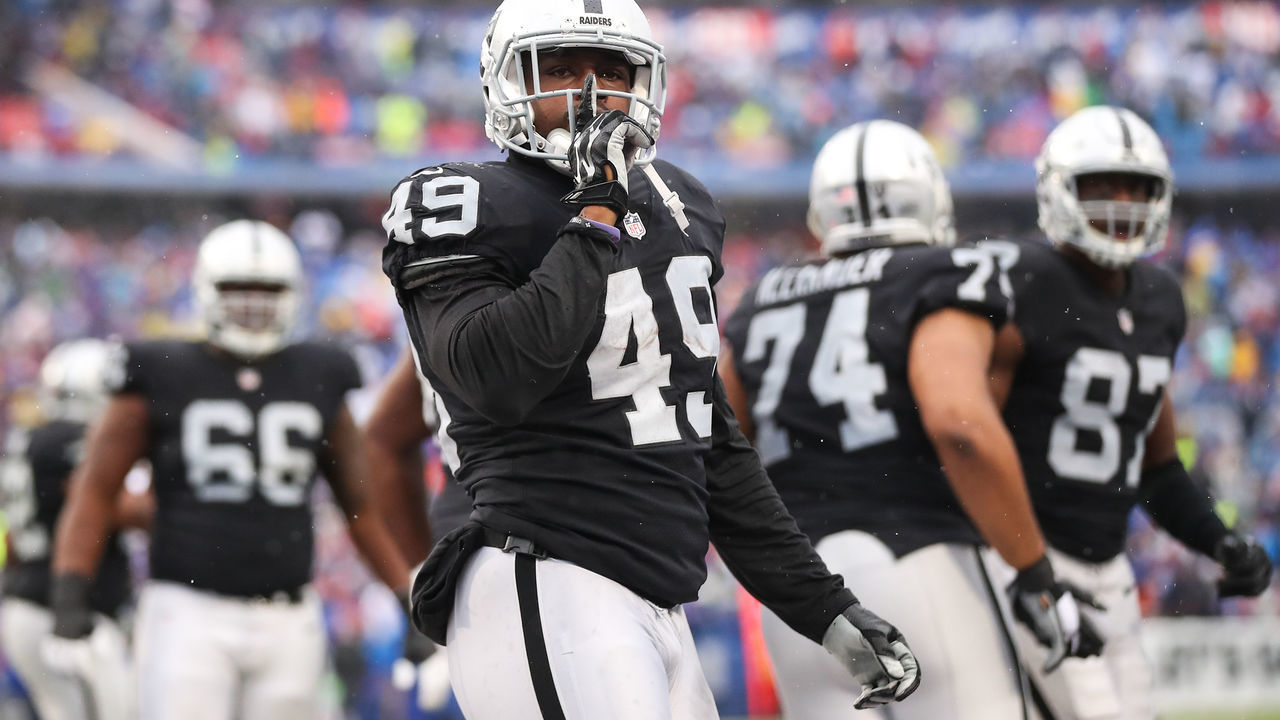ORCHARD PARK, NY - OCTOBER 29: Jamize Olawale #49 of the Oakland Raiders celebrates after scoring a touchdown during the first quarter of an NFL game against the Buffalo Bills on October 29, 2017 at New Era Field in Orchard Park, New York.
