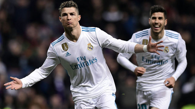 Real Madrid's Portuguese forward Cristiano Ronaldo celebrates a goal during the Spanish League football match between Real Madrid CF and Girona FC at the Santiago Bernabeu stadium in Madrid on March 18, 2018. / AFP PHOTO / JAVIER SORIANO