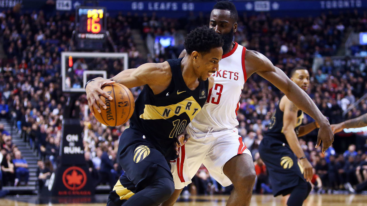 TORONTO, ON - MARCH 9: DeMar DeRozan #10 of the Toronto Raptors dribbles the ball as James Harden #13 of the Houston Rockets defends during the second half of an NBA game at Air Canada Centre on March 9, 2018 in Toronto, Canada.