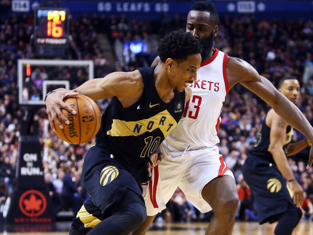TORONTO, ON - MARCH 9: DeMar DeRozan #10 of the Toronto Raptors dribbles the ball as James Harden #13 of the Houston Rockets defends during the second half of an NBA game at Air Canada Centre on March 9, 2018 in Toronto, Canada.