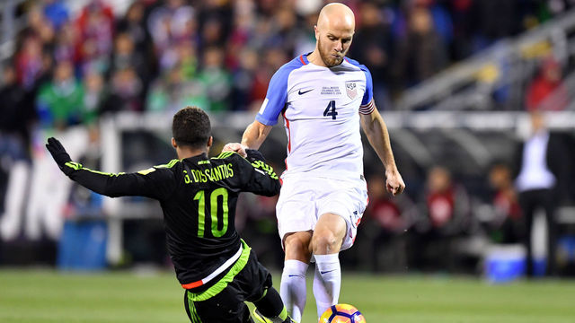 COLUMBUS, OH - NOVEMBER 11: Michael Bradley #4 of the United States dribbles the ball against Giovani Dos Santos #10 of Mexico in the first half during the FIFA 2018 World Cup Qualifier at MAPFRE Stadium on November 11, 2016 in Columbus, Ohio.
