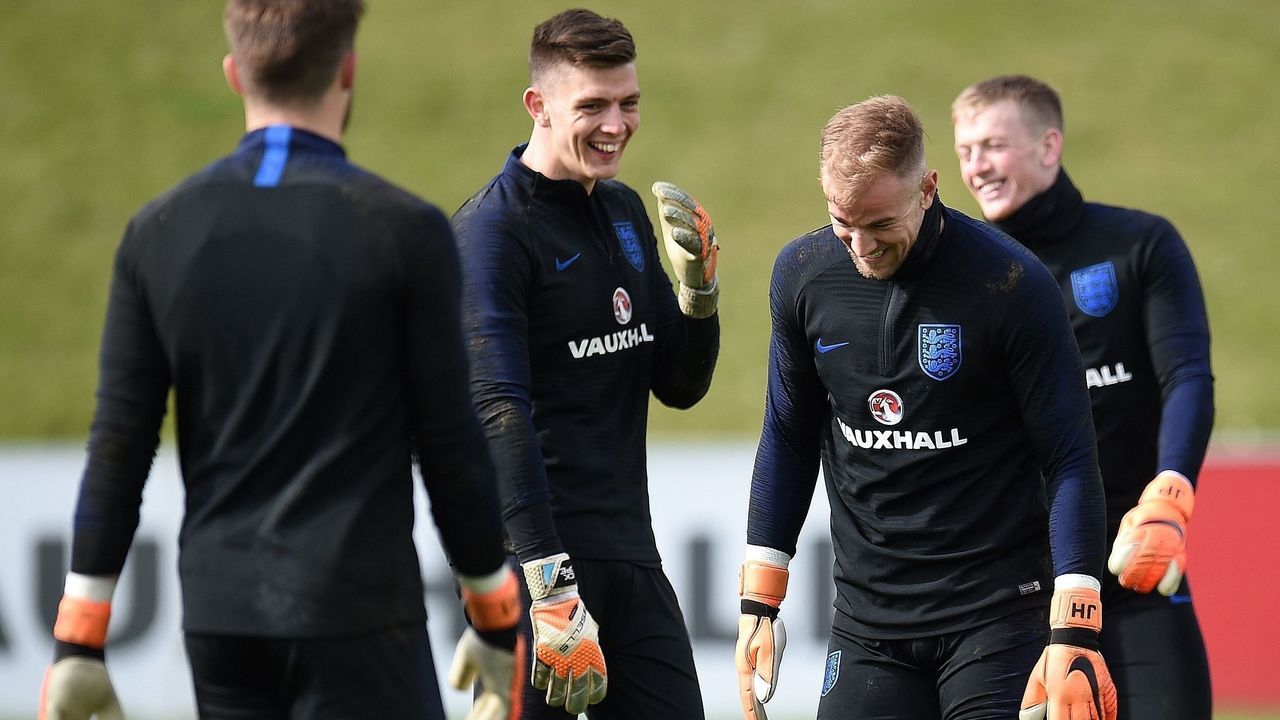 England goalkeepers Jack Butland (L), Nick Pope (2L), Joe Hart Jordan Pickford react during a training session at St George's Park in Burton-on-Trent on March 20, 2018, ahead of their international friendly football matches against the Netherlands on March 23 and Italy on March 27. / AFP PHOTO / Oli SCARFF / NOT FOR MARKETING OR ADVERTISING USE / RESTRICTED TO EDITORIAL USE