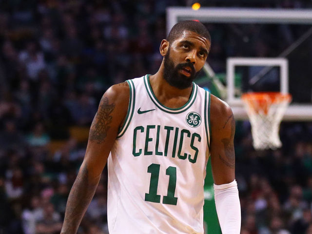 BOSTON, MA - JANUARY 3: LeBron James #23 of the Cleveland Cavaliers and Kyrie Irving #11 of the Boston Celtics look on during the second half at TD Garden on January 3, 2018 in Boston, Massachusetts.