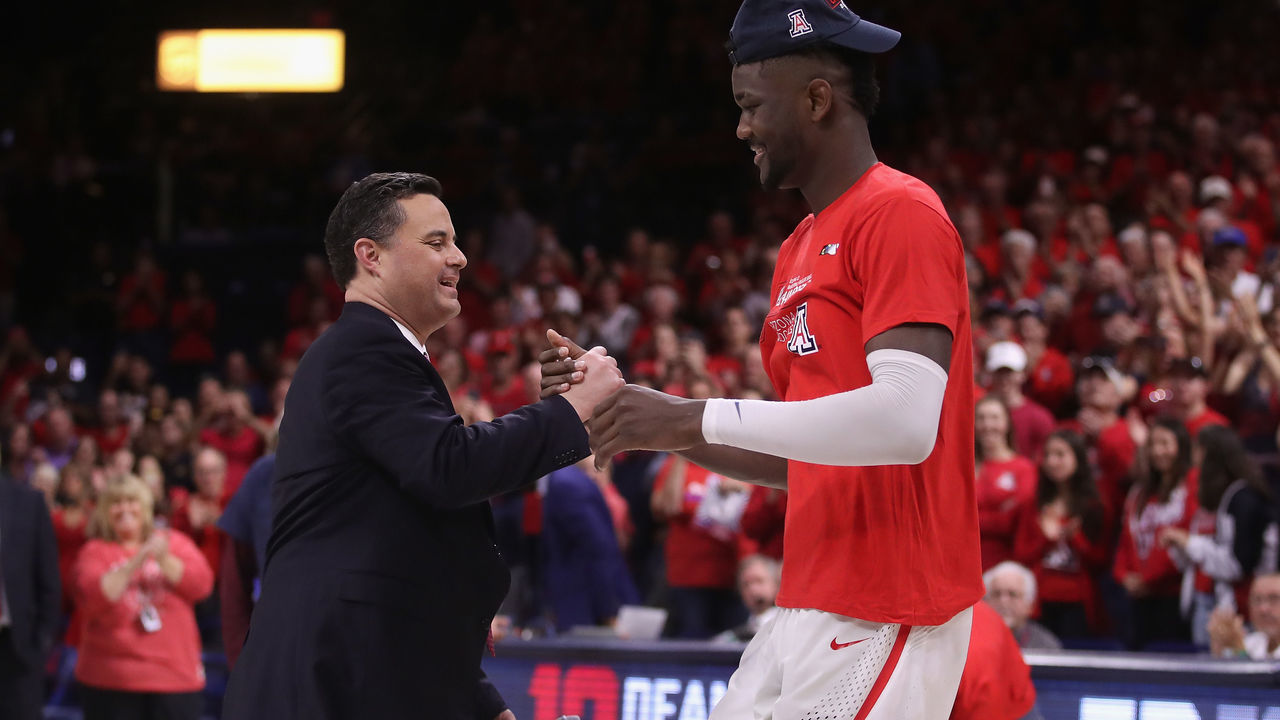 TUCSON, AZ - MARCH 03: Head coach Sean Miller of the Arizona Wildcats greets Deandre Ayton #13 after defeating the California Golden Bears 66-54 to win the PAC-12 Championship at McKale Center on March 3, 2018 in Tucson, Arizona.