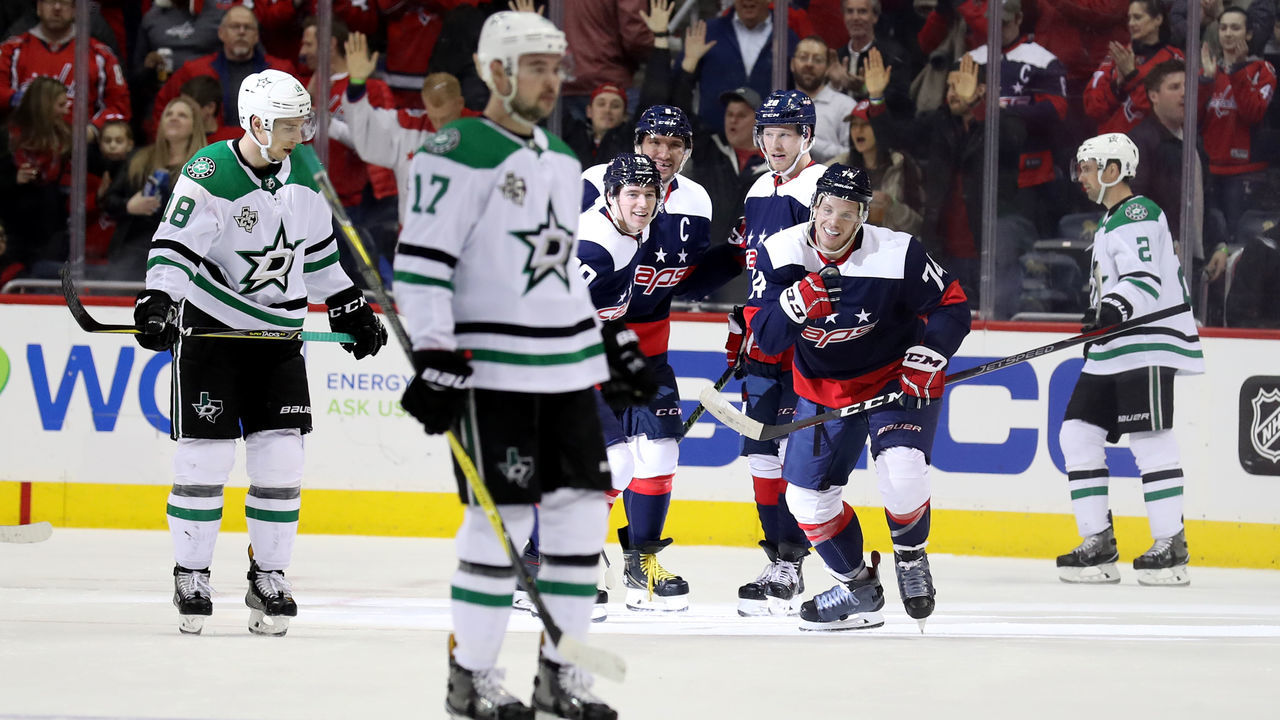 WASHINGTON, DC - MARCH 20: John Carlson #74 of the Washington Capitals celebrates after scoring a third period goal against the Dallas Stars at Capital One Arena on March 20, 2018 in Washington, DC.