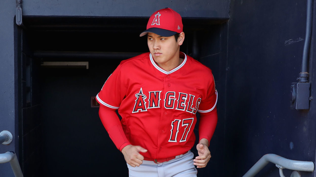 PEORIA, AZ - FEBRUARY 26: Shohei Ohtani #17 of the Los Angeles Angels walks in the dugout during the second inning of the spring training game against the San Diego Padres at Peoria Stadium on February 26, 2018 in Peoria, Arizona.