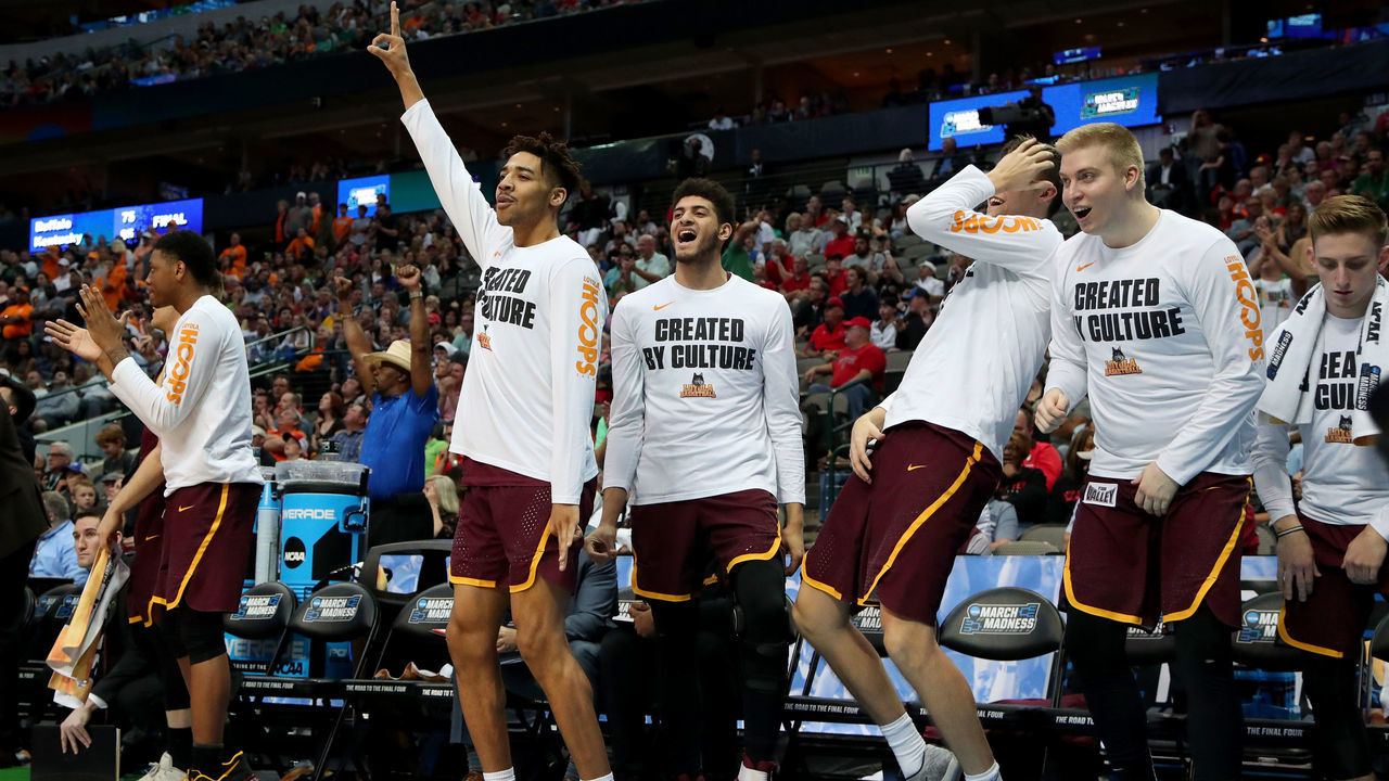 DALLAS, TX - MARCH 17: Members of the Loyola Ramblers bench celebrate in the second half against the Tennessee Volunteers during the second round of the 2018 NCAA Tournament at the American Airlines Center on March 17, 2018 in Dallas, Texas.